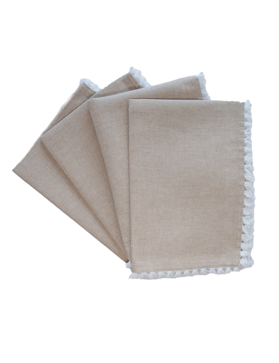 a set of linen placemat in natural colour with cotton tassel trim