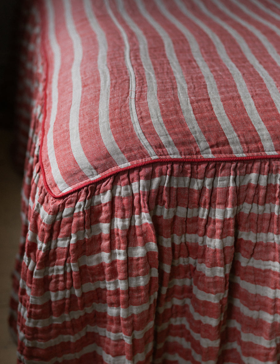 the details of red natural striped bed cover