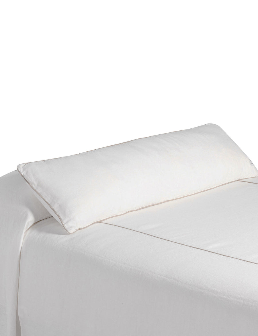 ecom shoot of the ivory bed coverlet and lumbar pillow