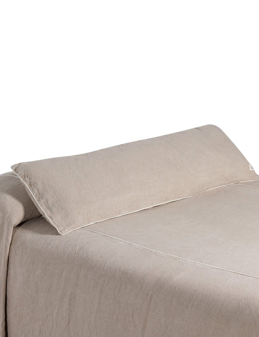 ecom shoot of the natural bed coverlet and lumbar pillow