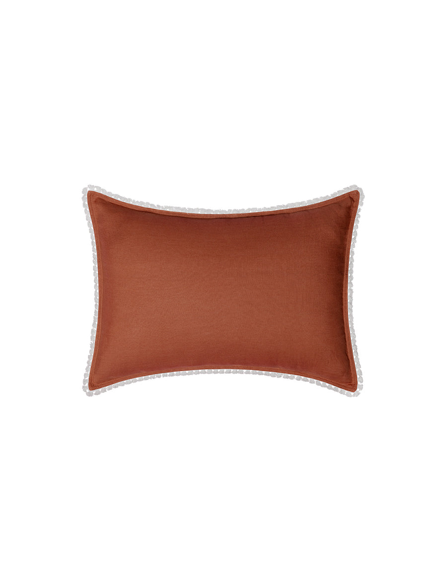 linen petite pillow with cotton tassel trim in rust colour
