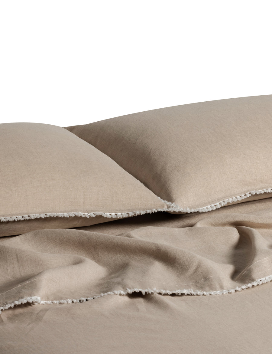 linen quilt set in natural colour and finished in our contrast organic cotton tassel trim
