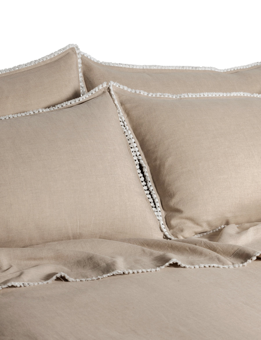linen quilt set in natural colour and finished in our contrast organic cotton tassel trim