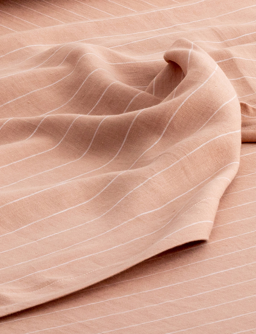 details of pinstripe linen sheet set in nude with white stripes