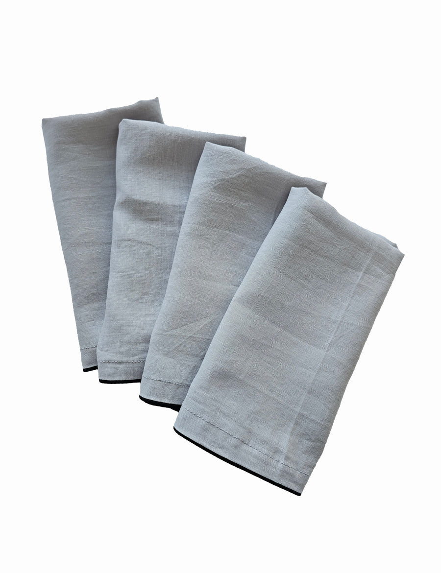 linen table napkins in cement colour with charcoal piping