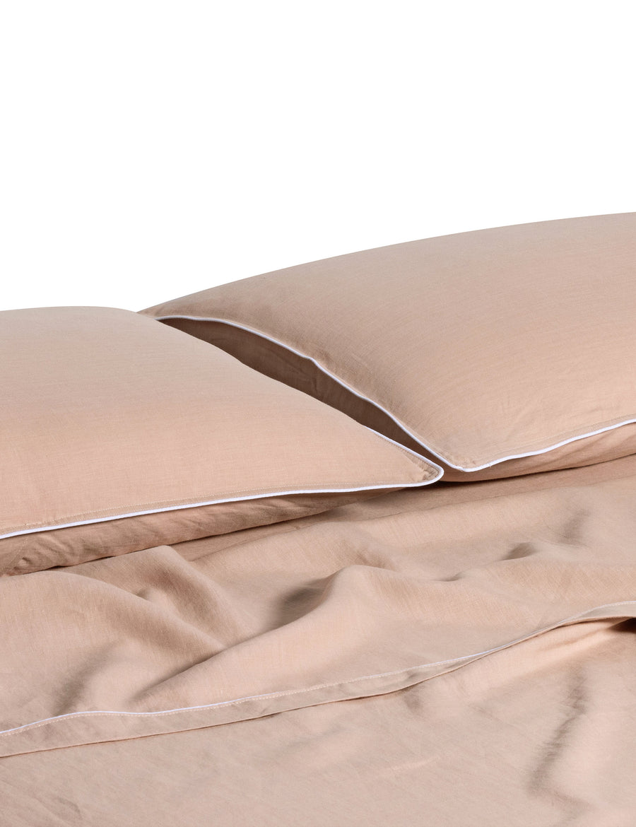 linen piped sheet set in blush colour with white piping
