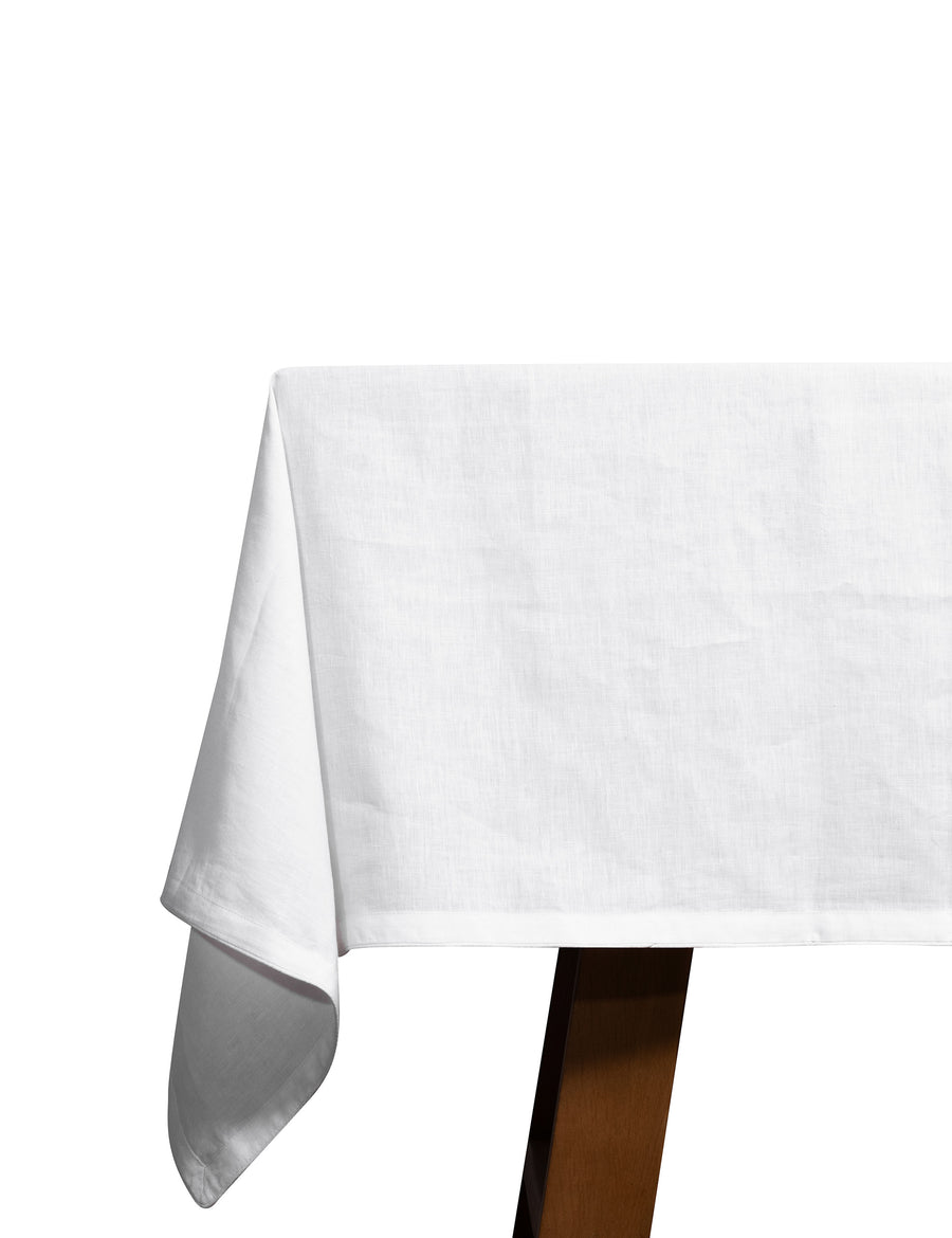 piped linen tablecloth in white with white piping