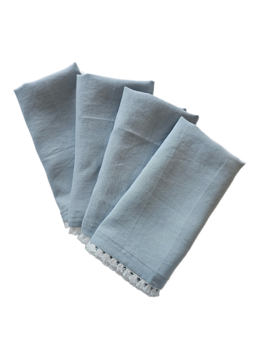 linen table napkins in cloud colour with cotton tassel trim in white