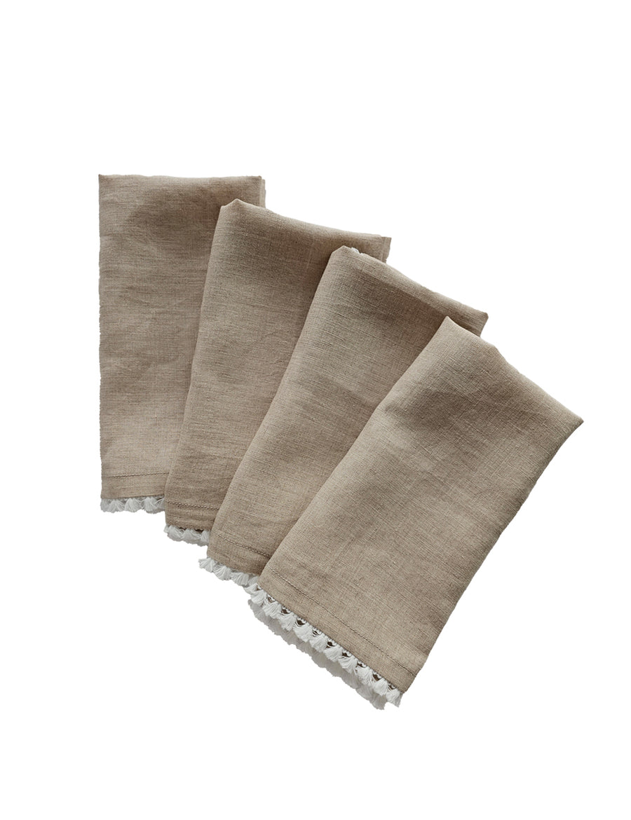 linen table napkins in natural colour with cotton tassel trim in white