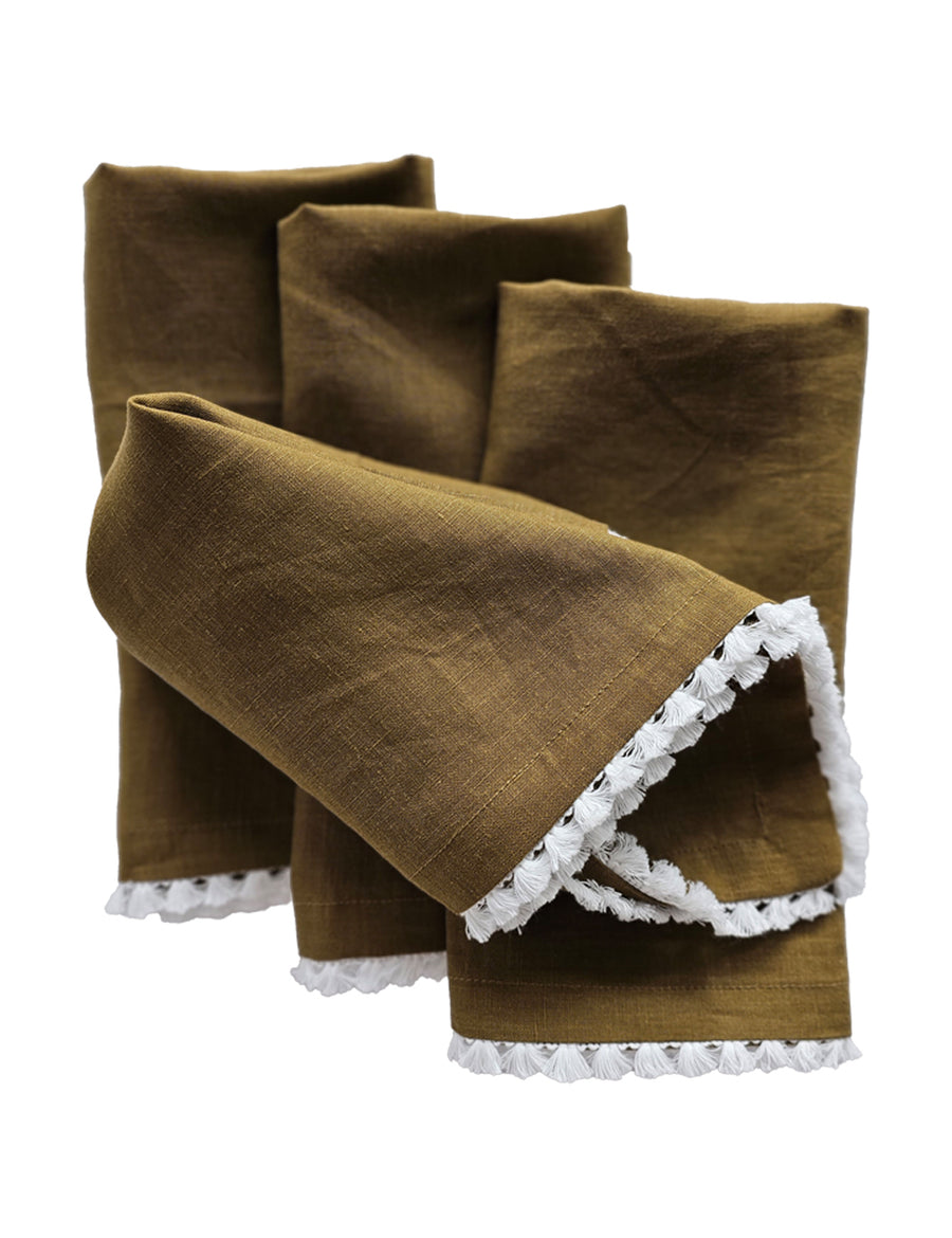linen table napkins in olive colour with cotton tassel trim in white