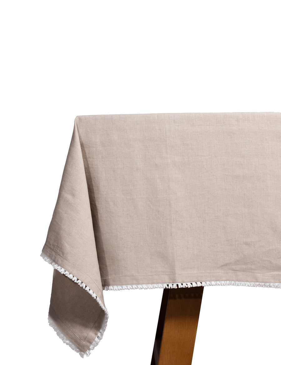 linen tablecloth in natural colour with cotton tassel trim in white