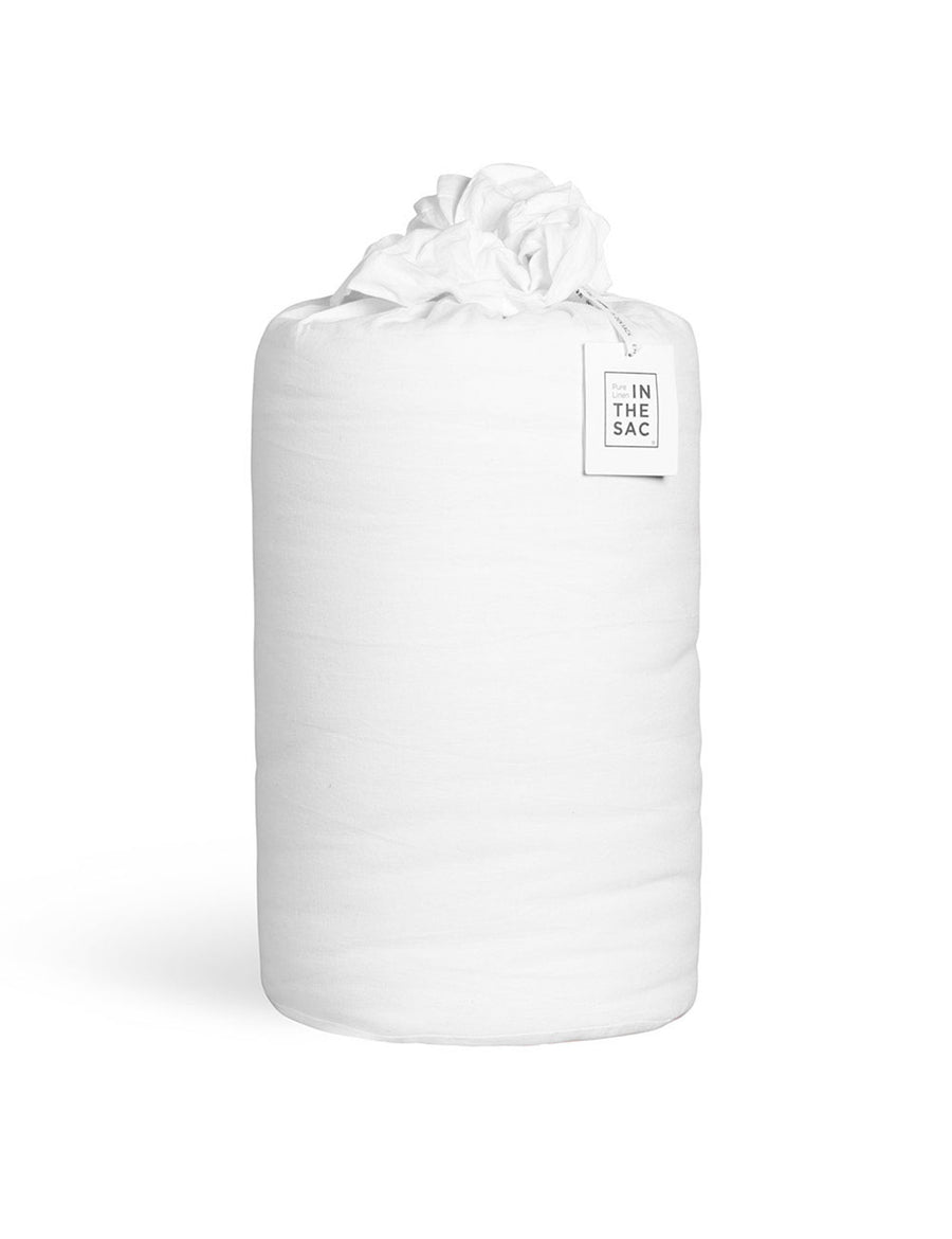 the packaging of the luxurious reversible quilted coverlets in white and natural colour