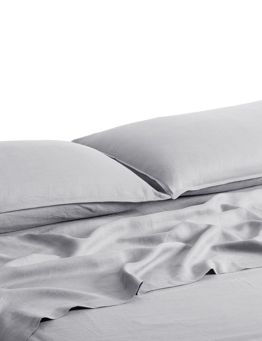 ecom shot of our classic linen sheet set in cement colour