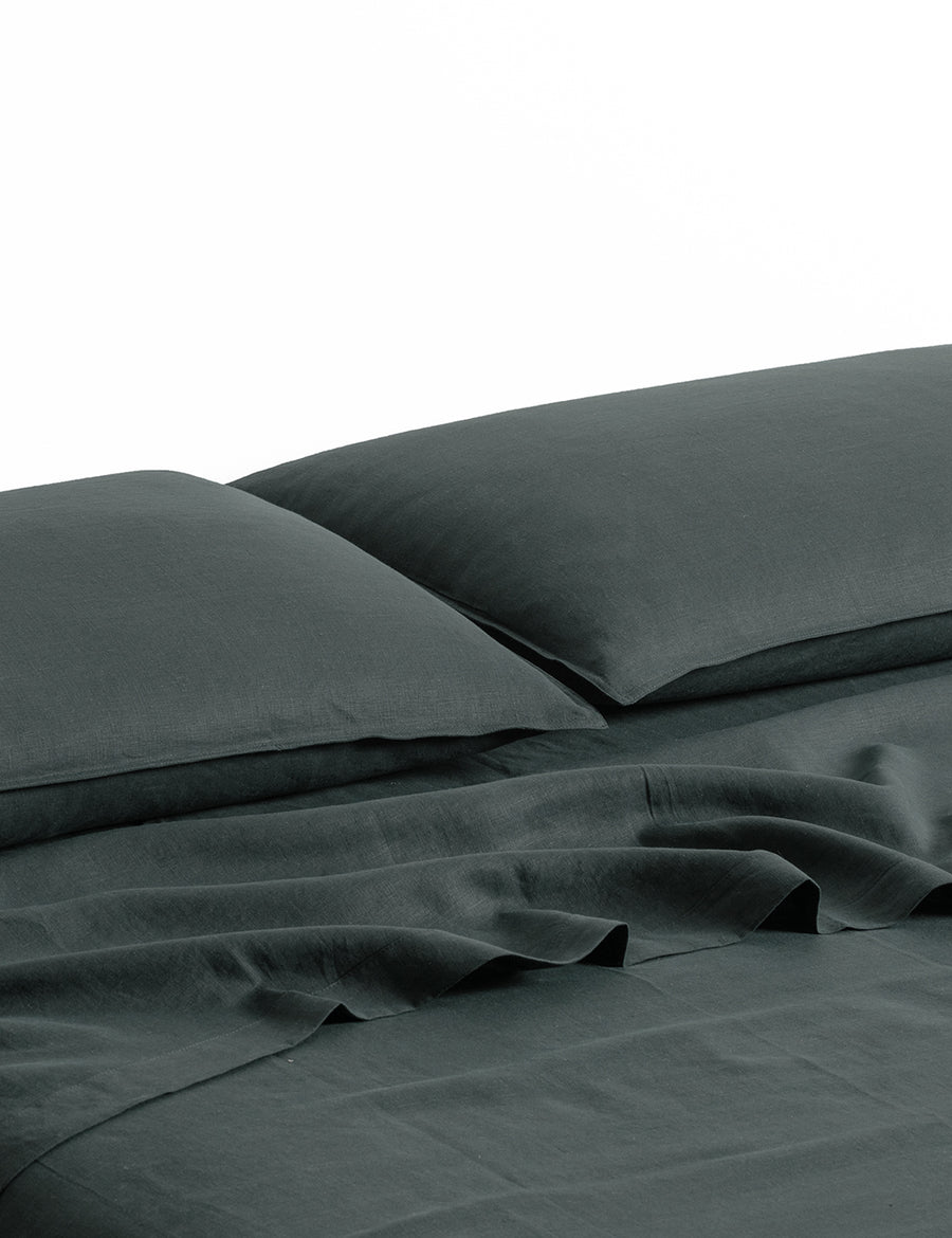 ecom shot of our classic linen sheet set in cypress colour