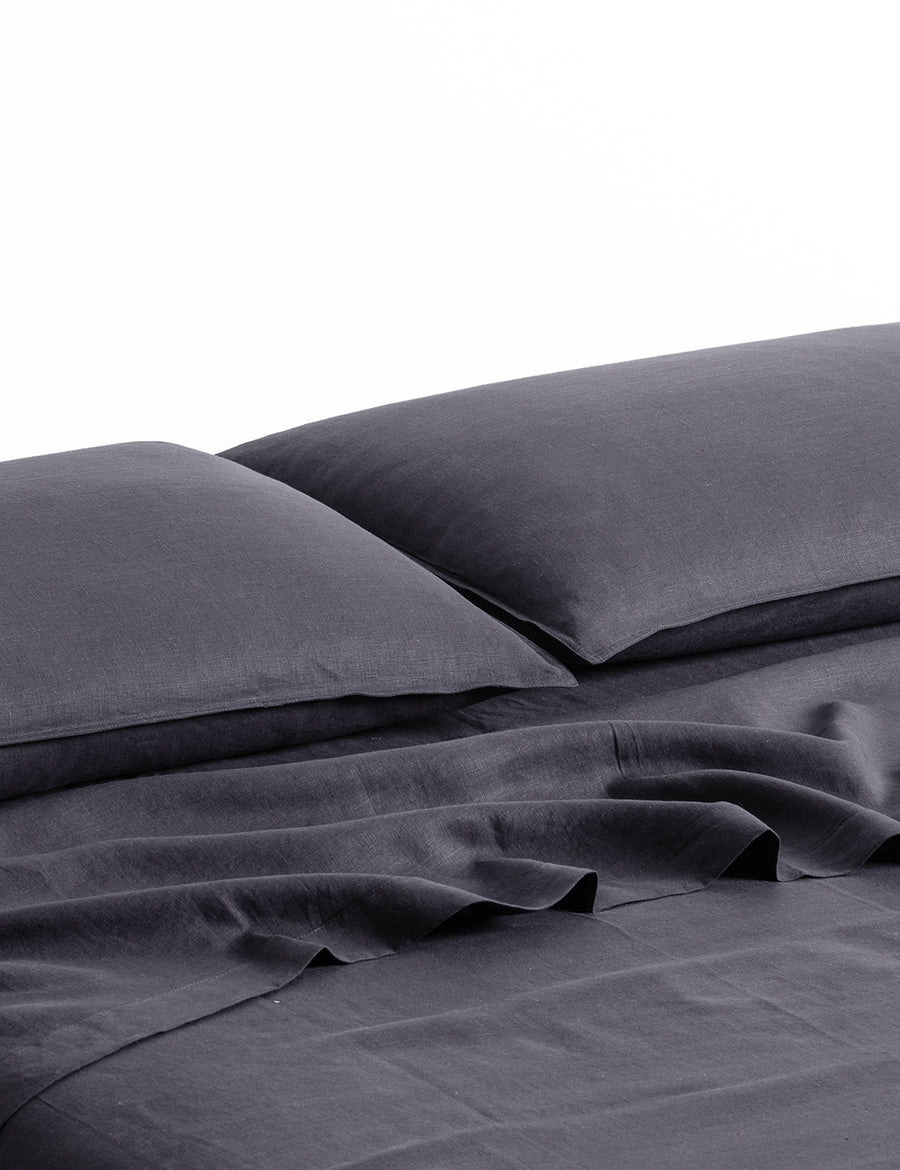 ecom shot of our classic linen sheet set in graphite colour