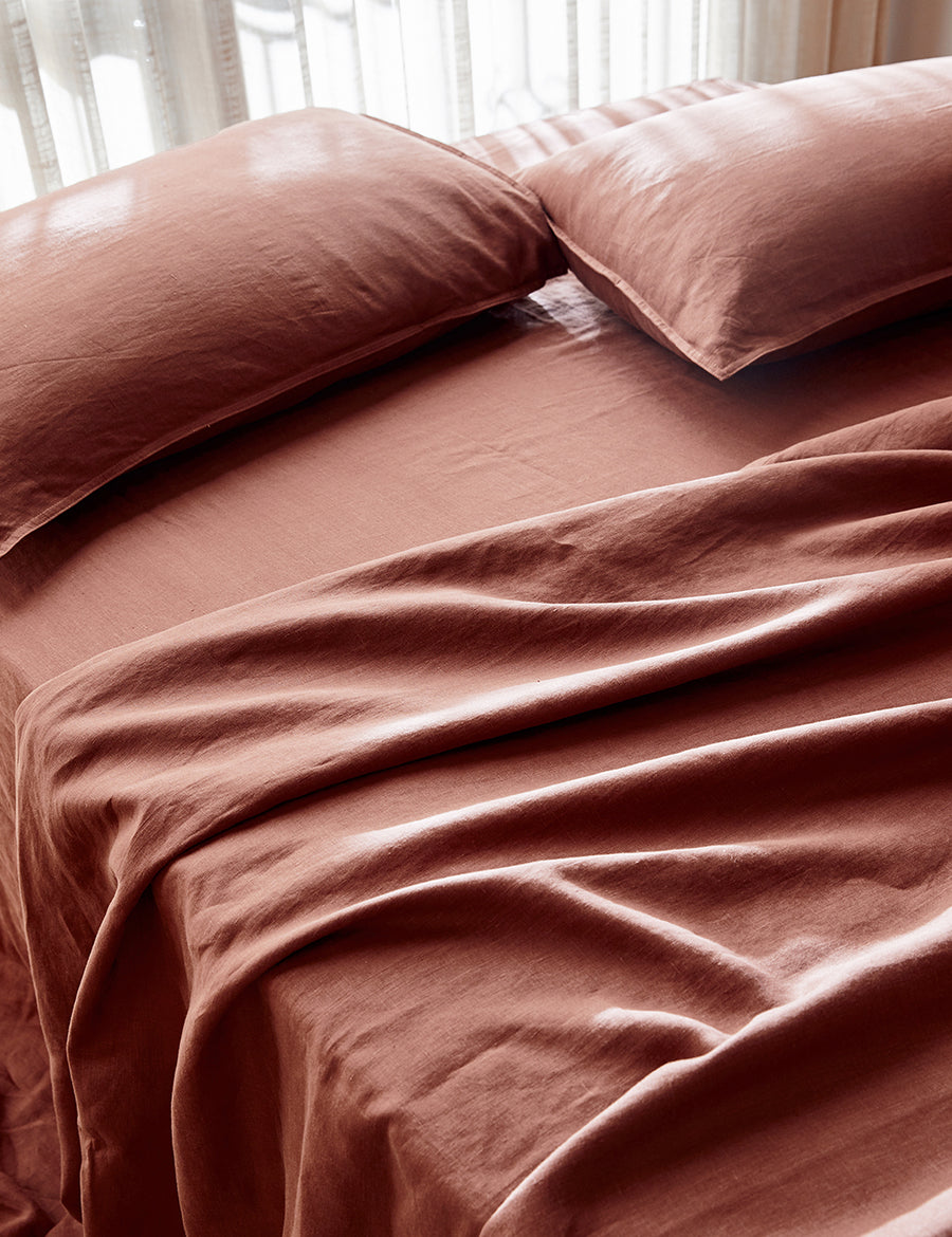 close up shot of the classic linen sheet set in maple