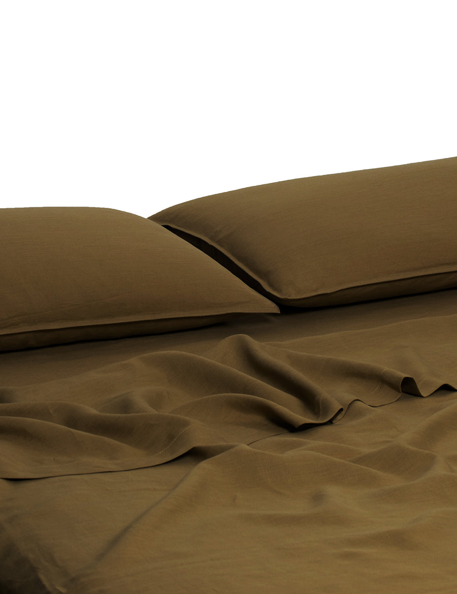 ecom shot of our classic linen sheet set in olive colour