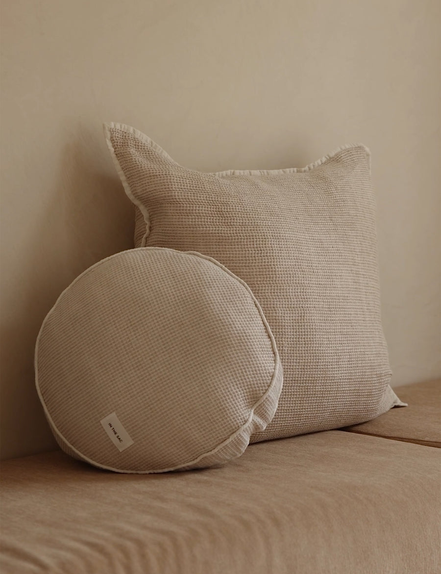 lifestyle shoot of linen cotton textured macaron pillow with matching european pillow