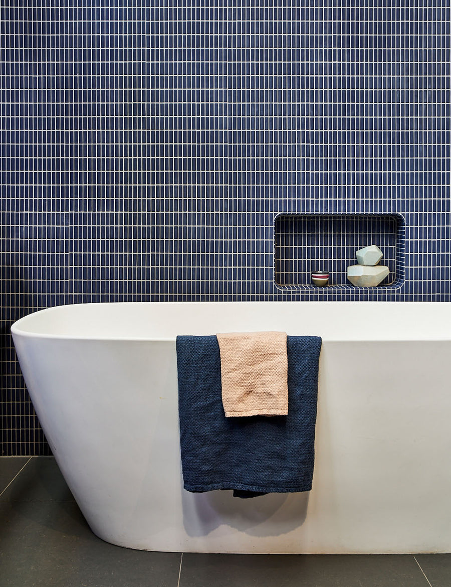 lifestyle shot of linen jacquard bath towel in denim colour