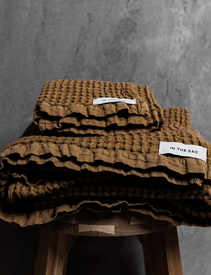 stacked photo of linen waffle towels in olive colour