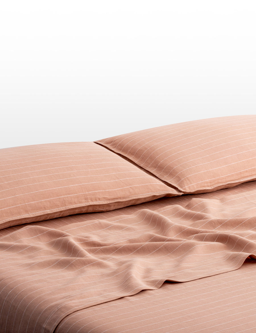 pinstripe linen sheet set in nude with white stripes