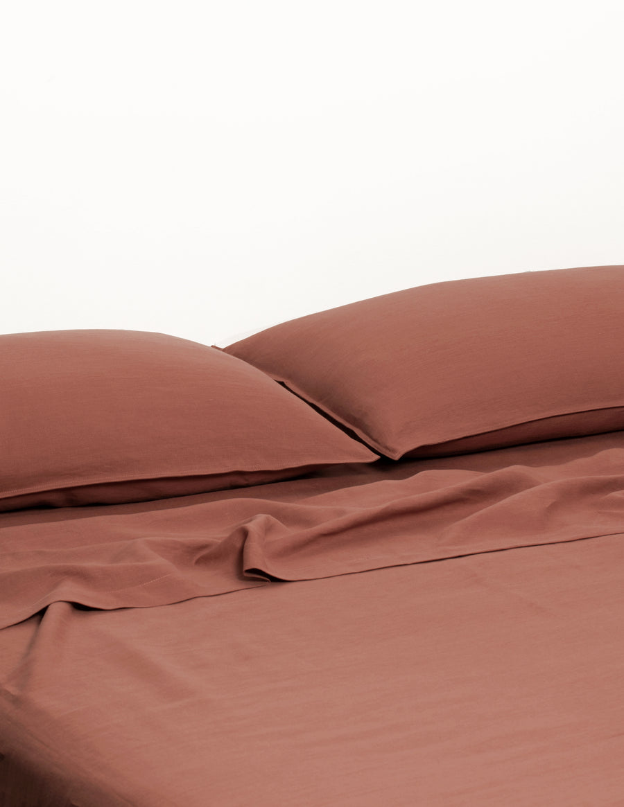 ecom shot of our classic linen sheet set in maple colour