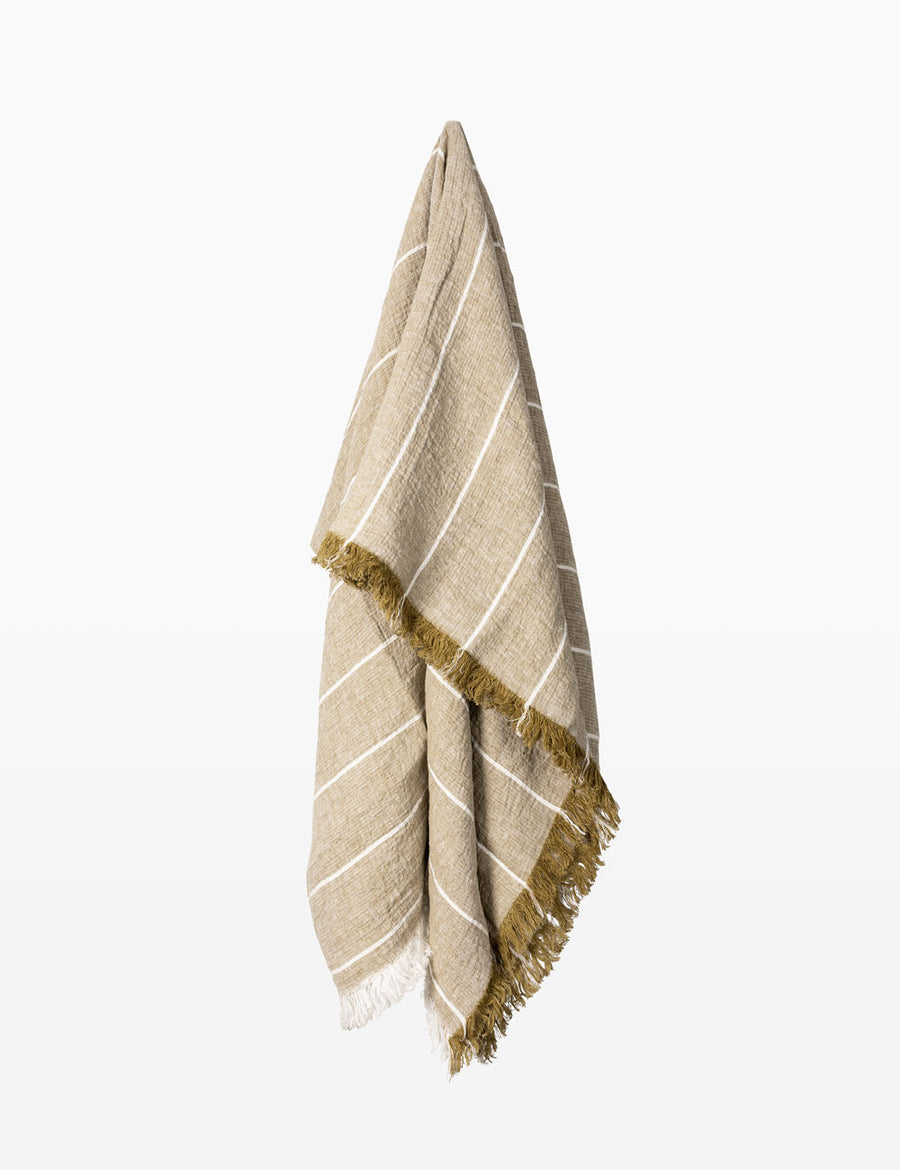 detail shot of textured linen throw with fringe trim in stripes willow with natural