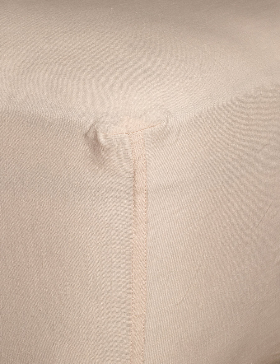corner details of linen fitted sheet in ballet colour