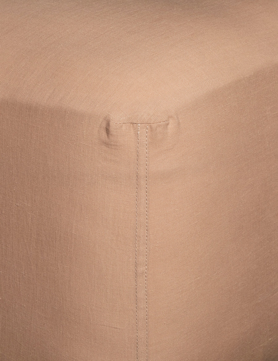 corner details of linen fitted sheet in nude colour