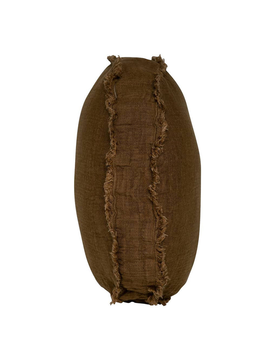 textured linen macaron shaped pillow with fringe trim in tobacco colour