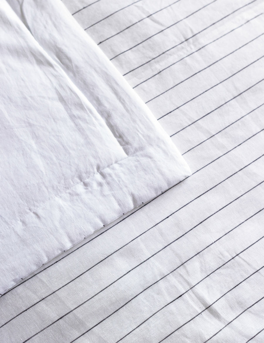 colour swatch of the reversible linen quilted coverlet in white and charcoal pinstripe