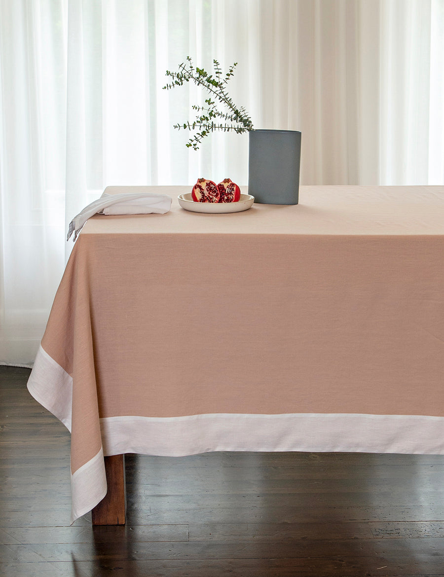 reversible linen tablecloth in nude and white with pomegranate and blue vase