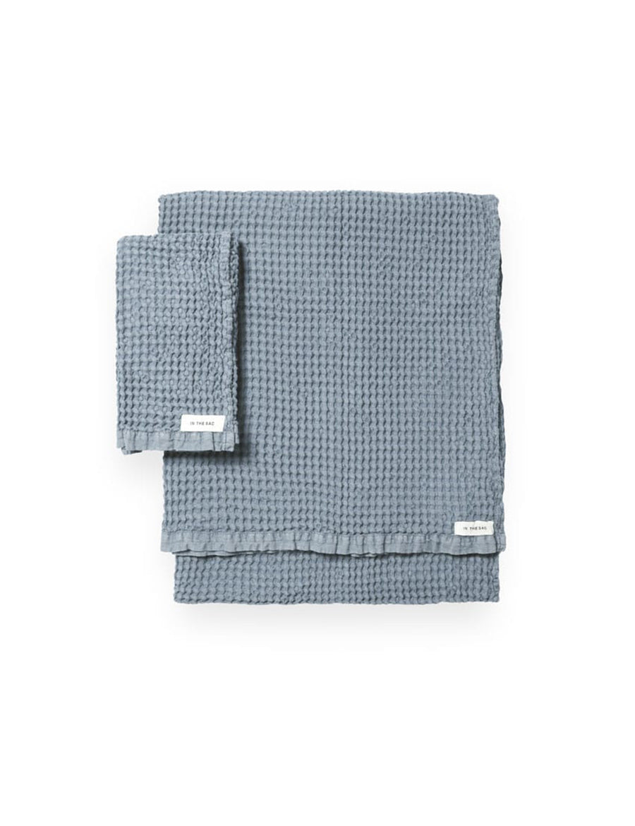 stacked photo of linen waffle hand towel in cloud colour with matching bath towel