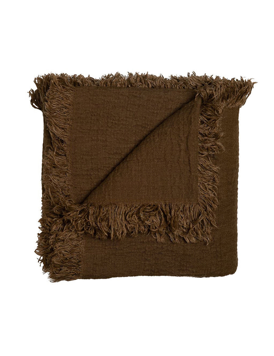 textured linen throw with fringe trim in tobacco colour