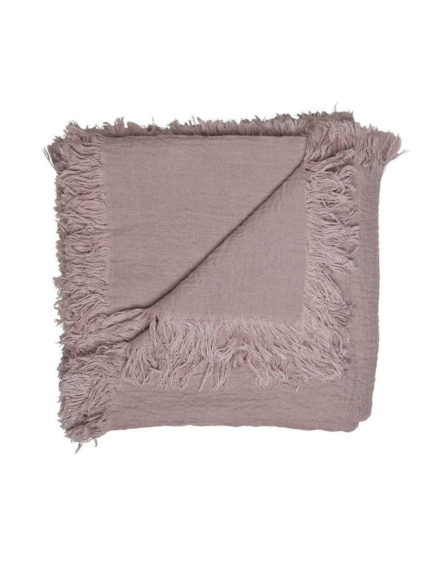 textured linen throw with fringe trim in musk colour
