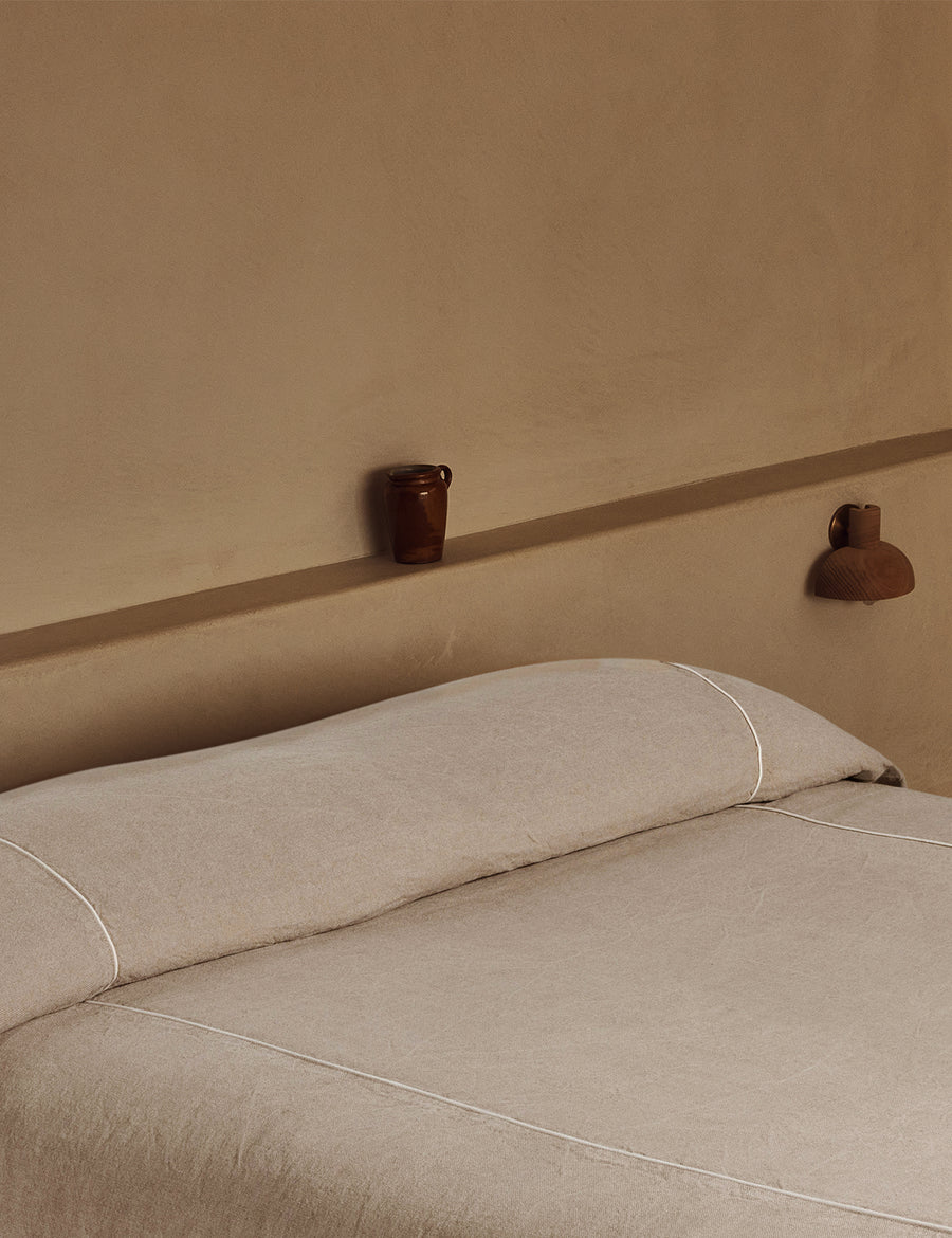 heavy-weighted linen Coverlet in fresh natural linen, featuring a subtle natural contrast piping detail