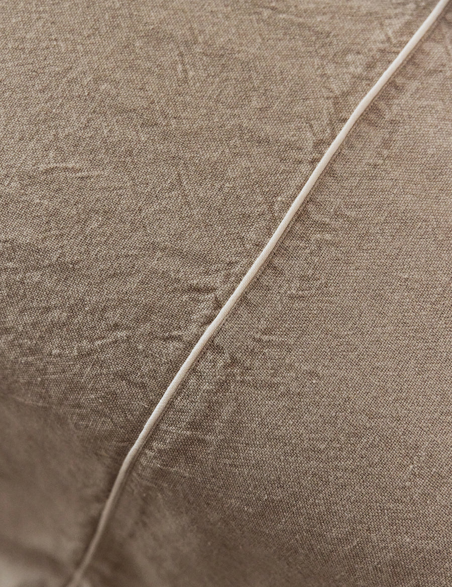 details of the piping of the natural coverlet