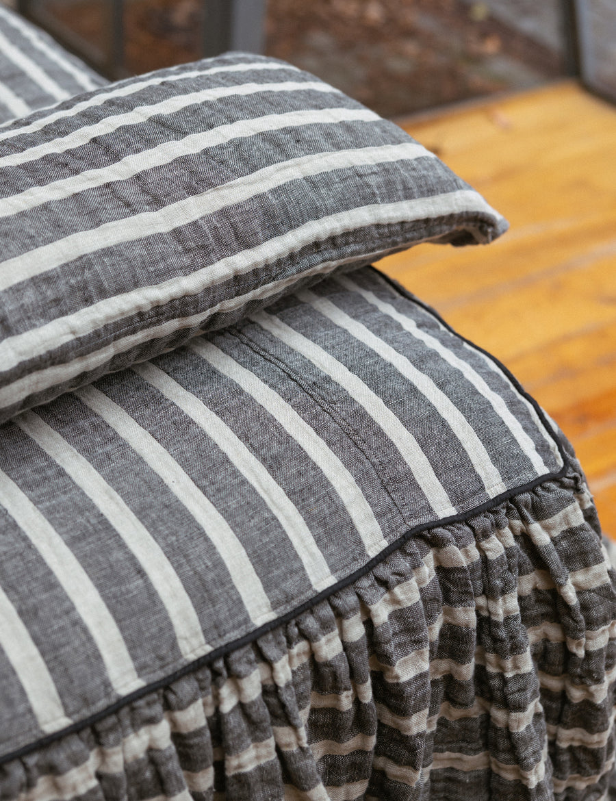 close up photo of charcoal natural lumbar pillow