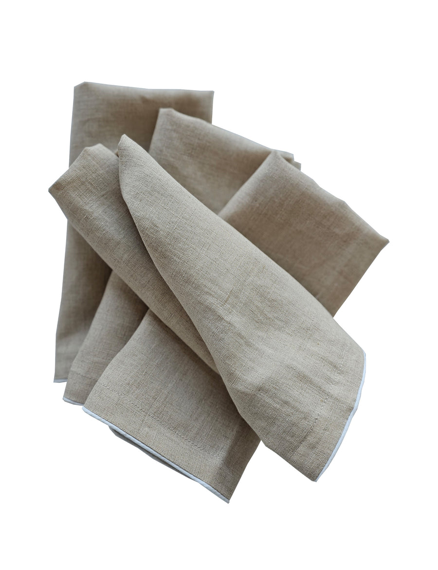 linen table napkins in natural colour with white piping