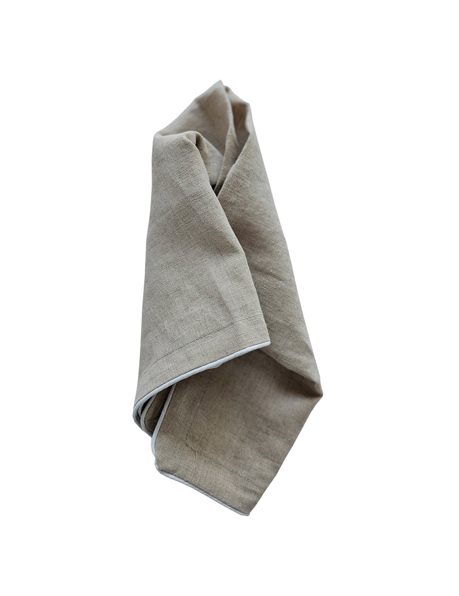 linen table napkin in natural colour with white piping