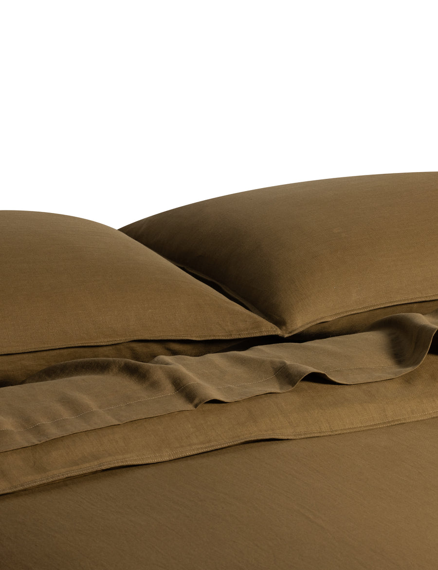 ecom shot of the classic linen quilt set in olive colour