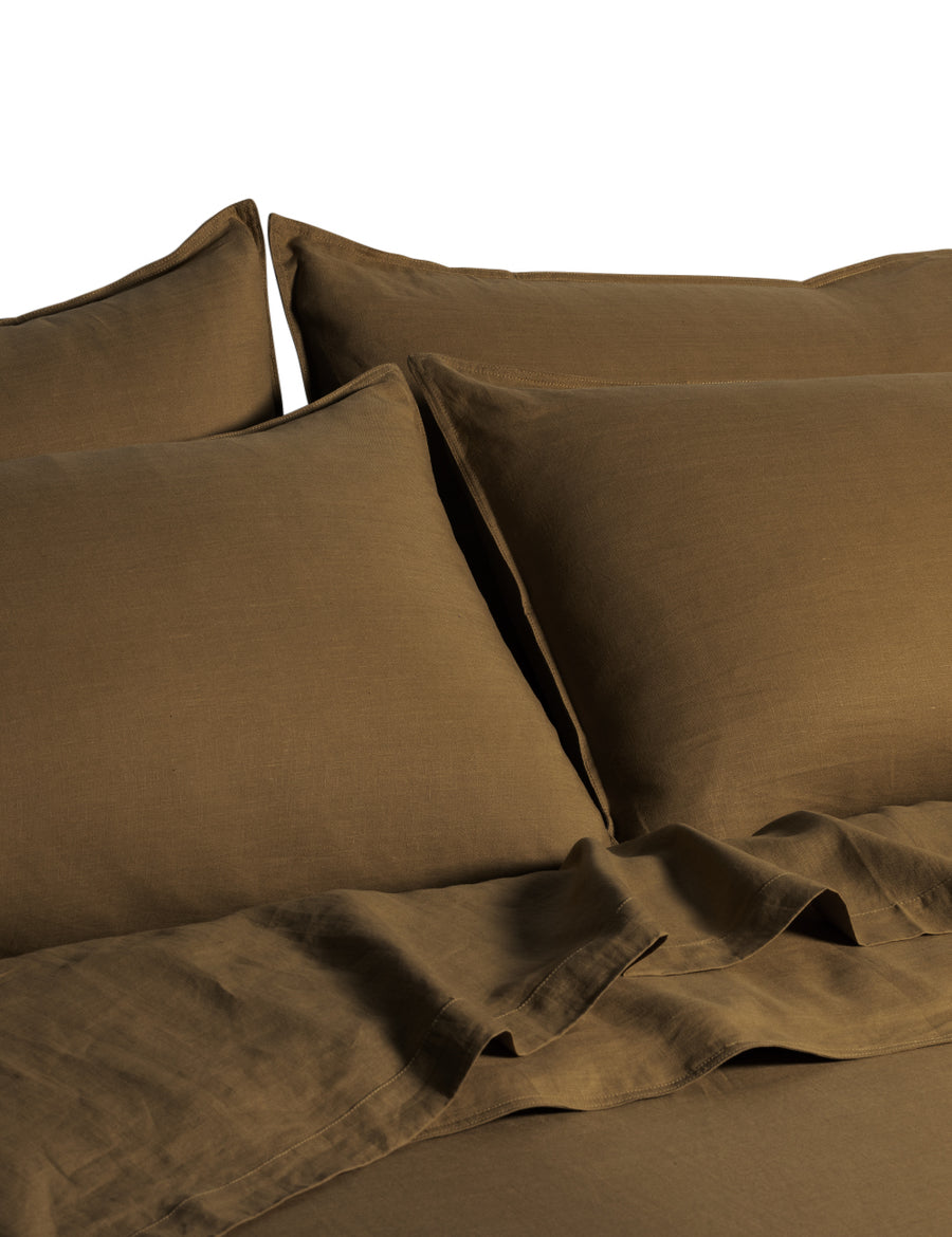 ecom shot of the classic linen quilt set in olive colour