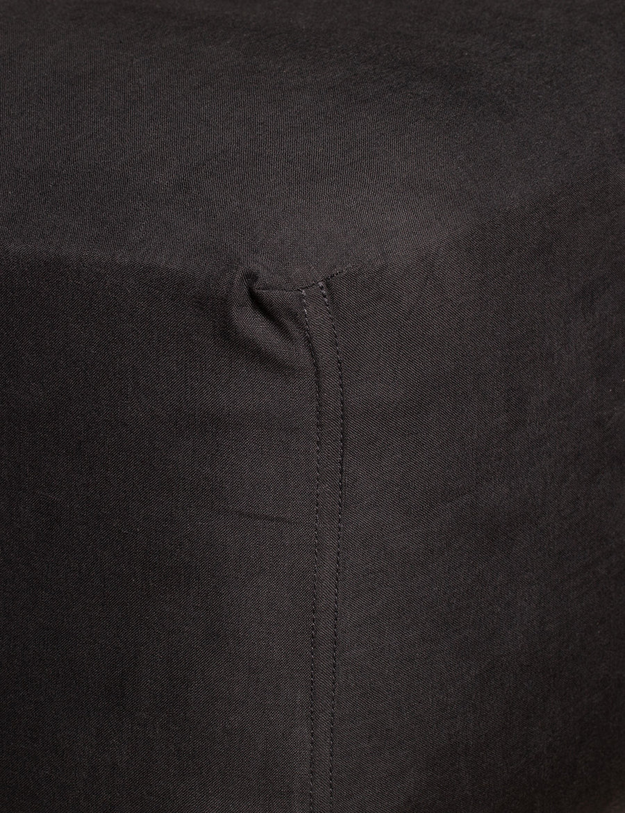corner details of linen fitted sheet in charcoal colour