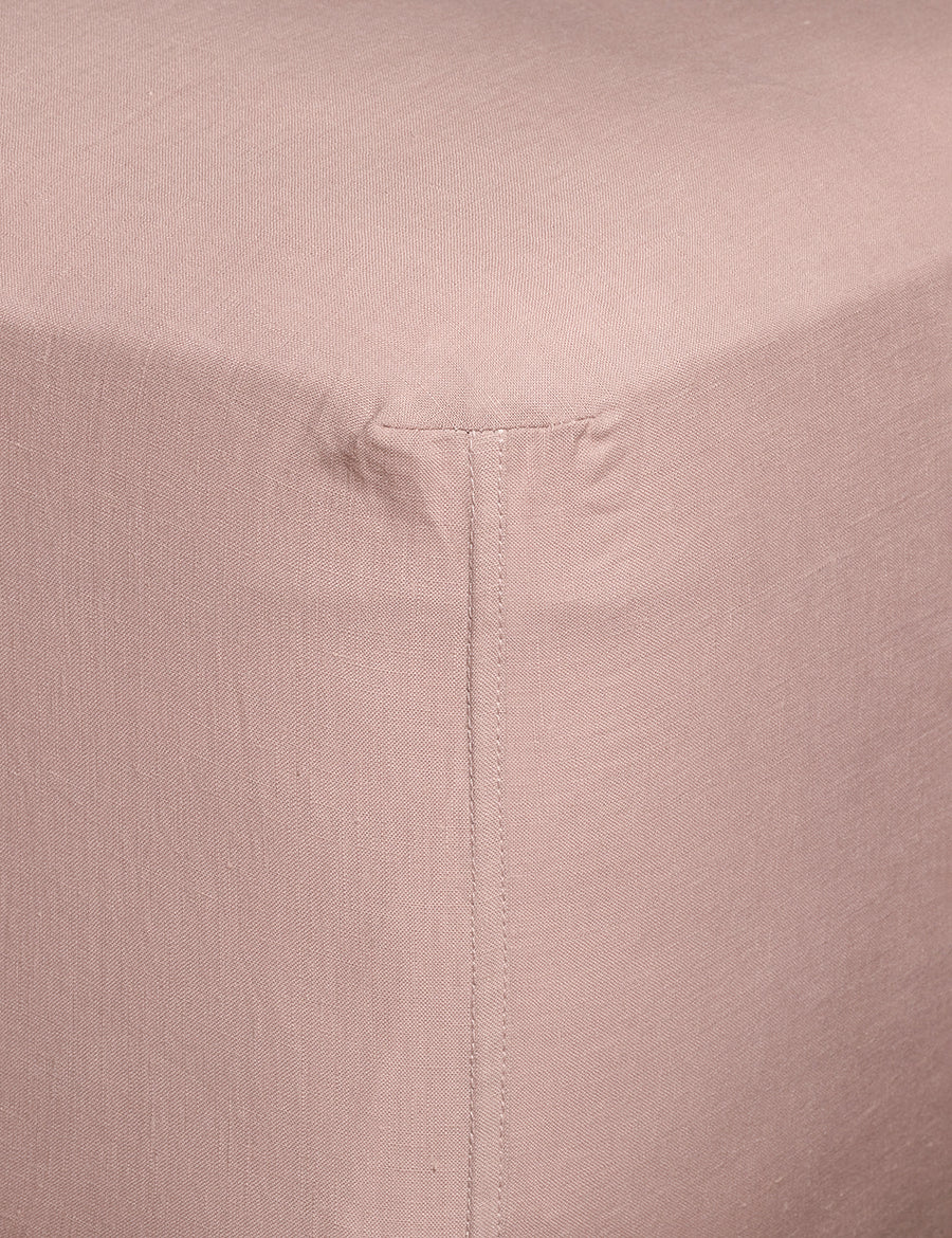 corner details of linen fitted sheet in musk colour