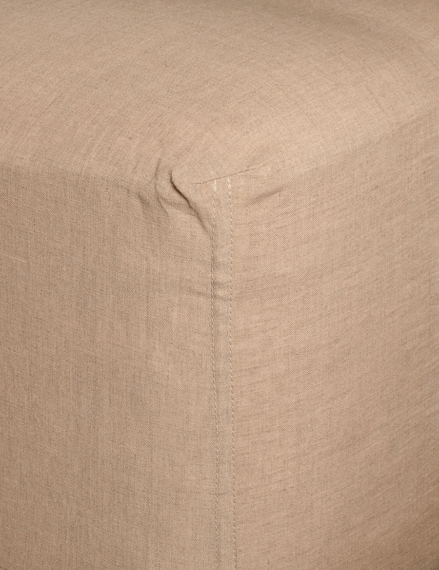 corner details of linen fitted sheet in natural colour