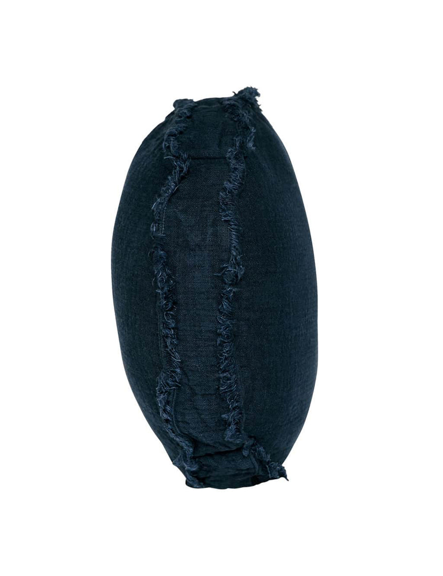 textured linen macaron shaped pillow with fringe trim in denim colour